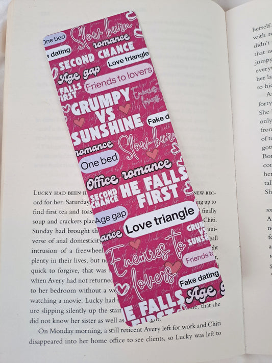 Pink, double-sided print romance tropes bookmark.