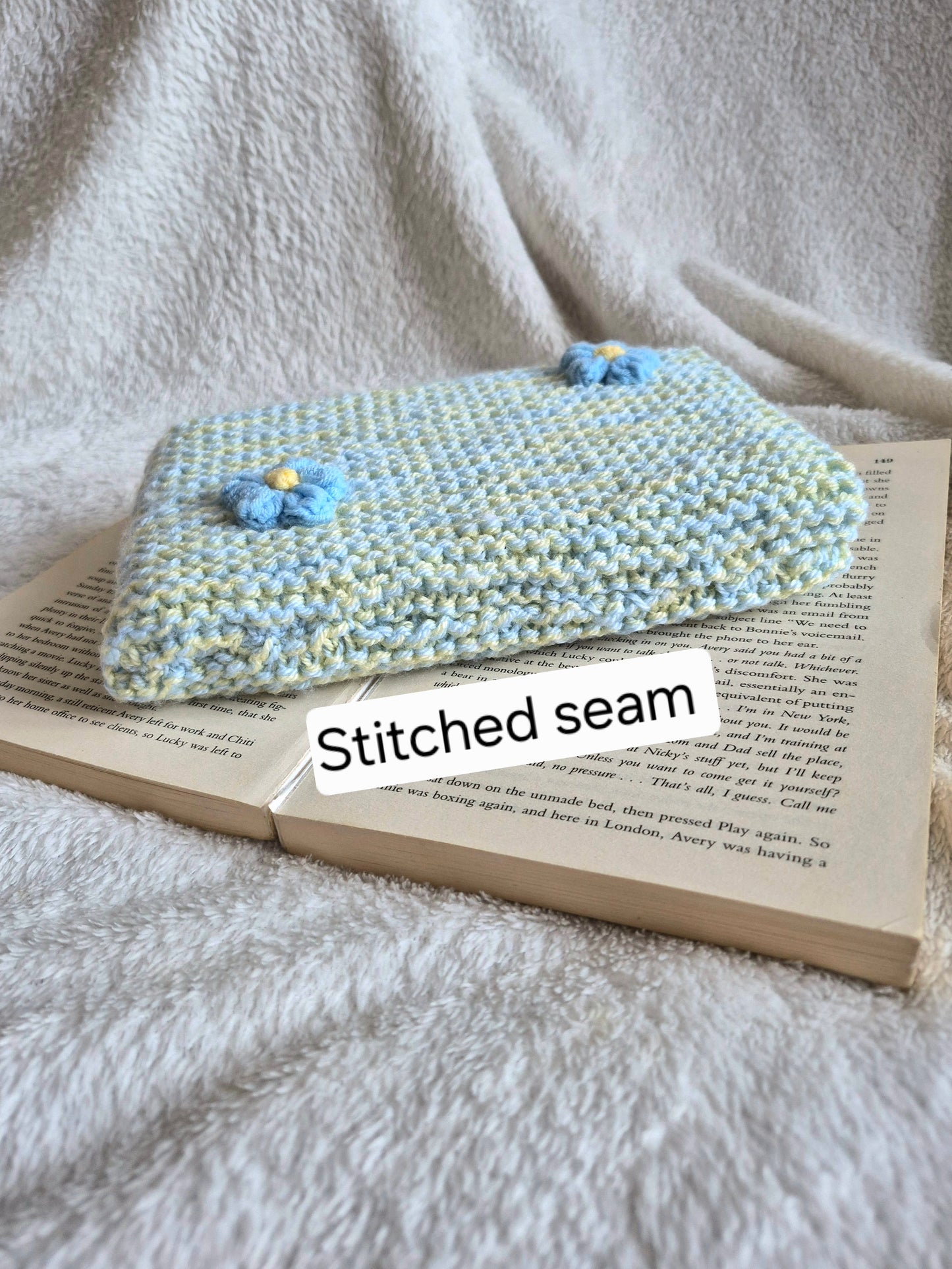 Blue & Yellow knitted book sleeve with blue flowers