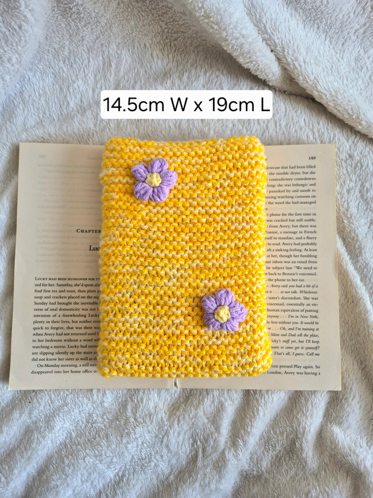 Large yellow knitted Kindle sleeve with purple flowers