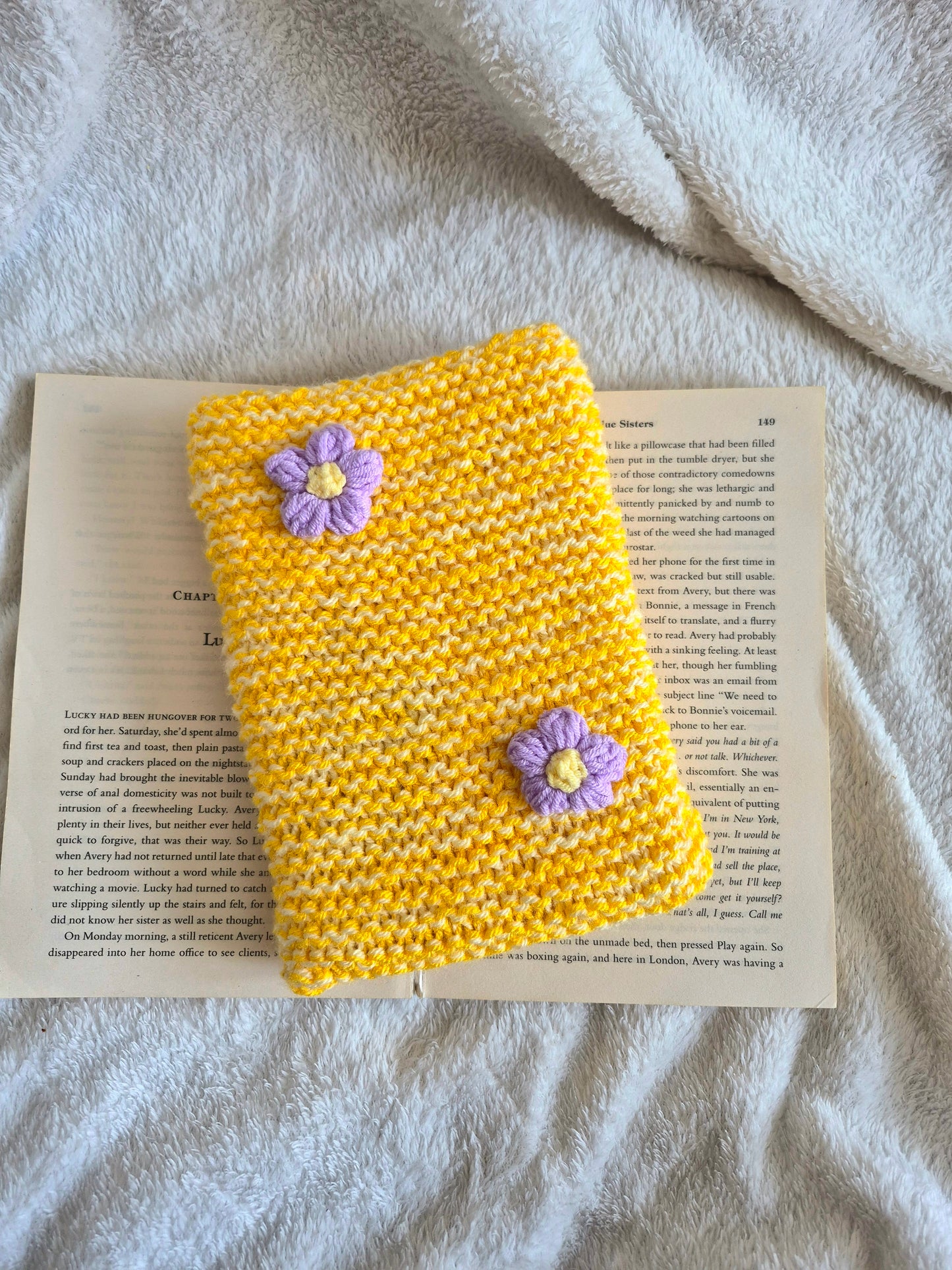 Large yellow knitted Kindle sleeve with purple flowers