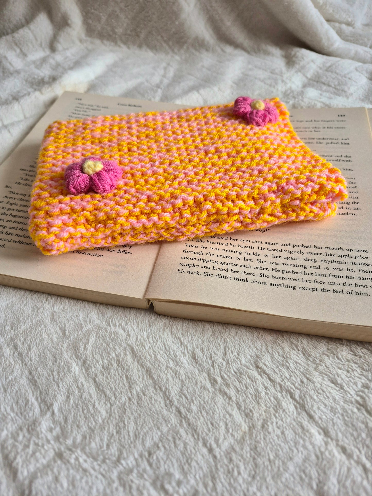 Large orange and pink knitted Kindle sleeve with pink flowers