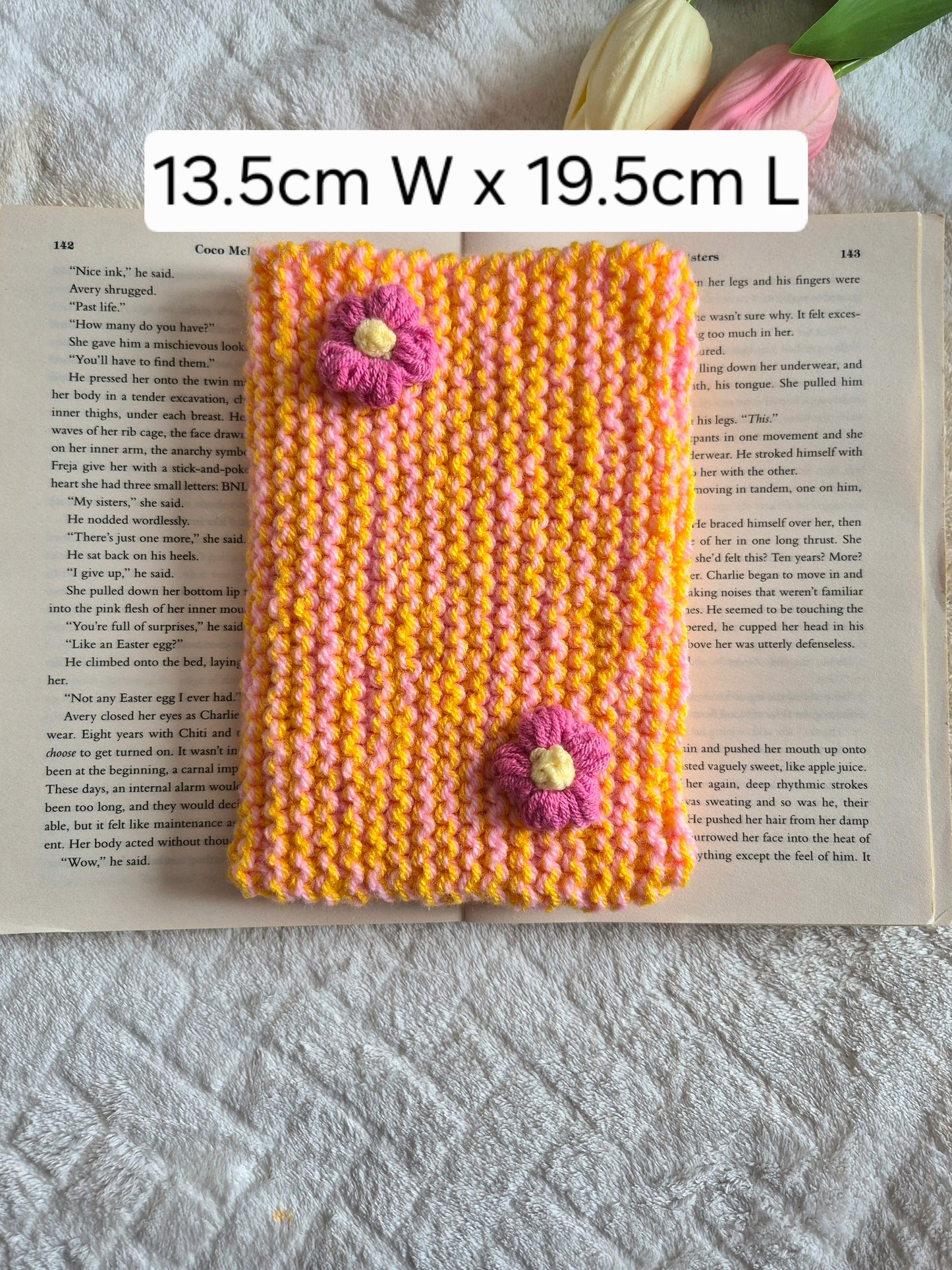 Large orange and pink knitted Kindle sleeve with pink flowers
