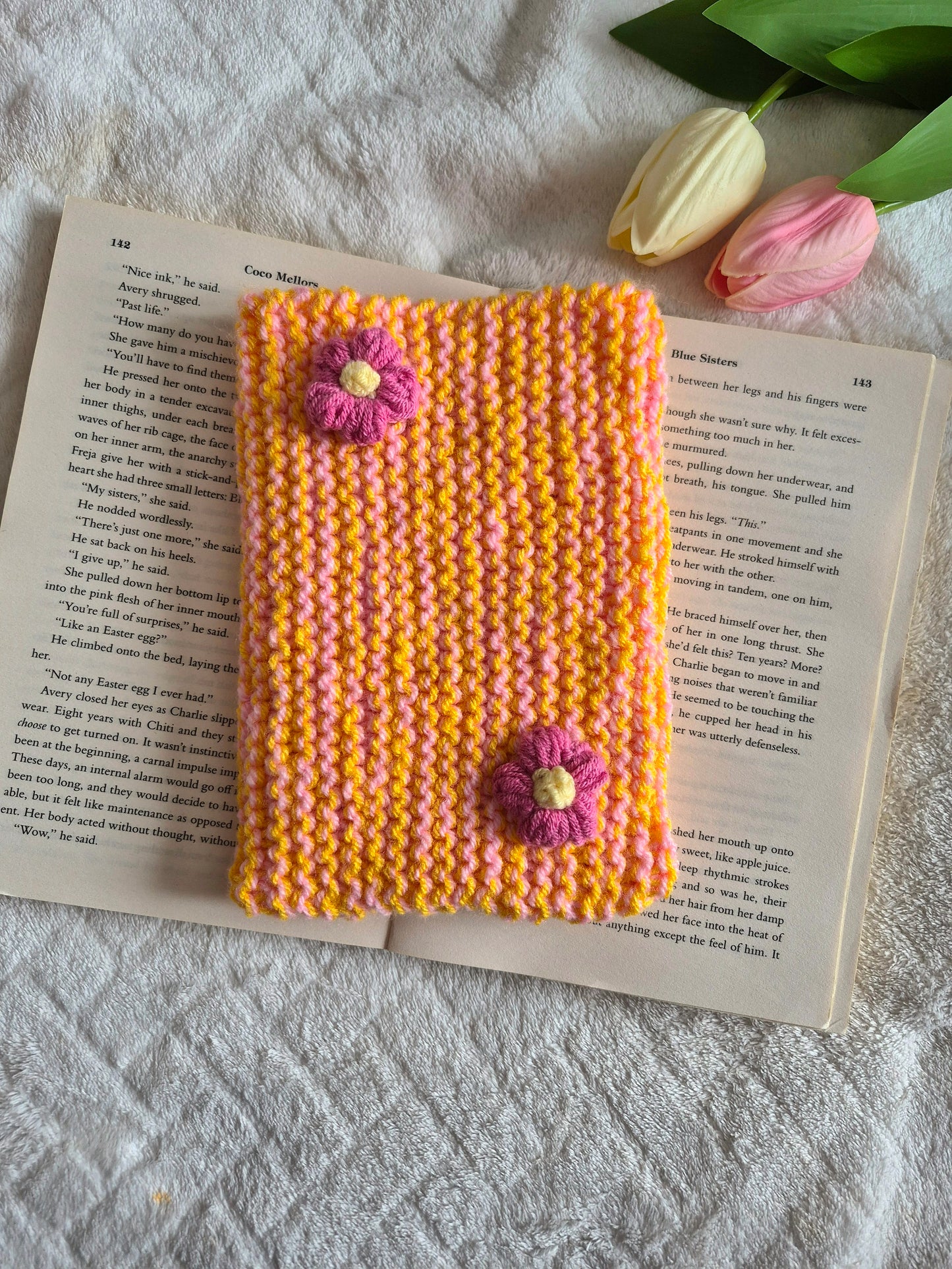 Large orange and pink knitted Kindle sleeve with pink flowers