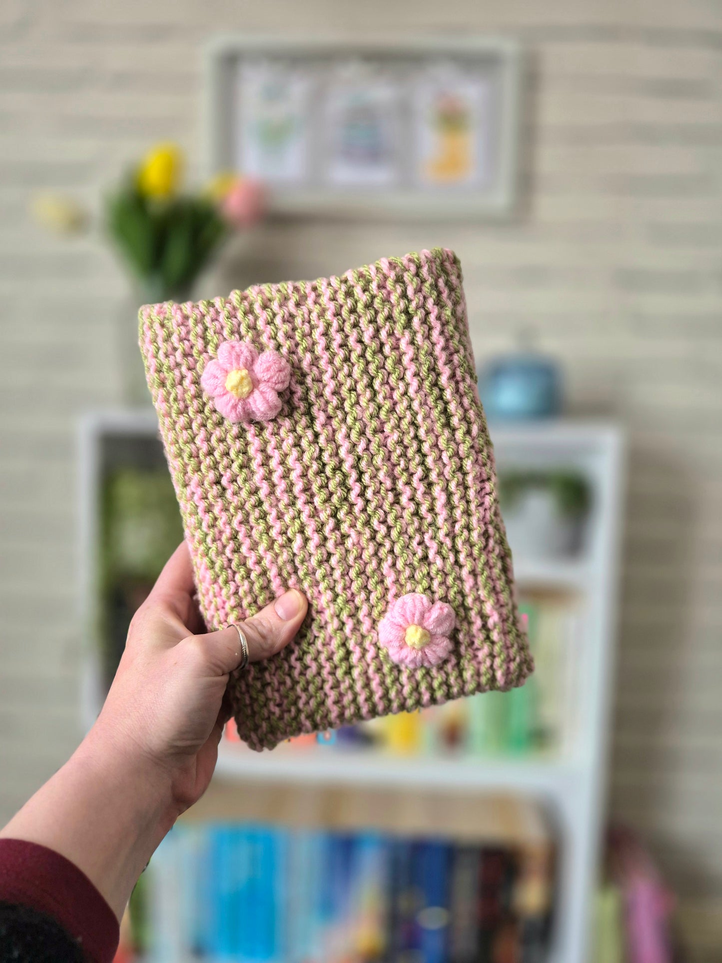 Green and pink knitted book sleeve