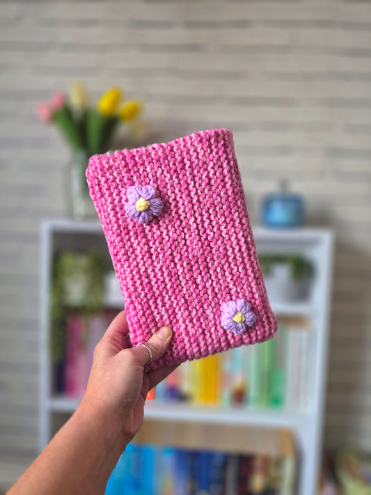 Pink Knitted book sleeve with purple flowers