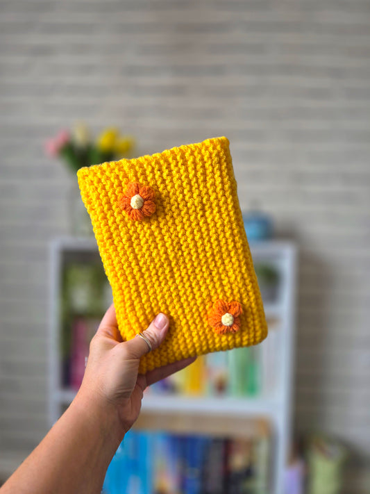 Dark Yellow/Orange Knitted book sleeve with orange flowers