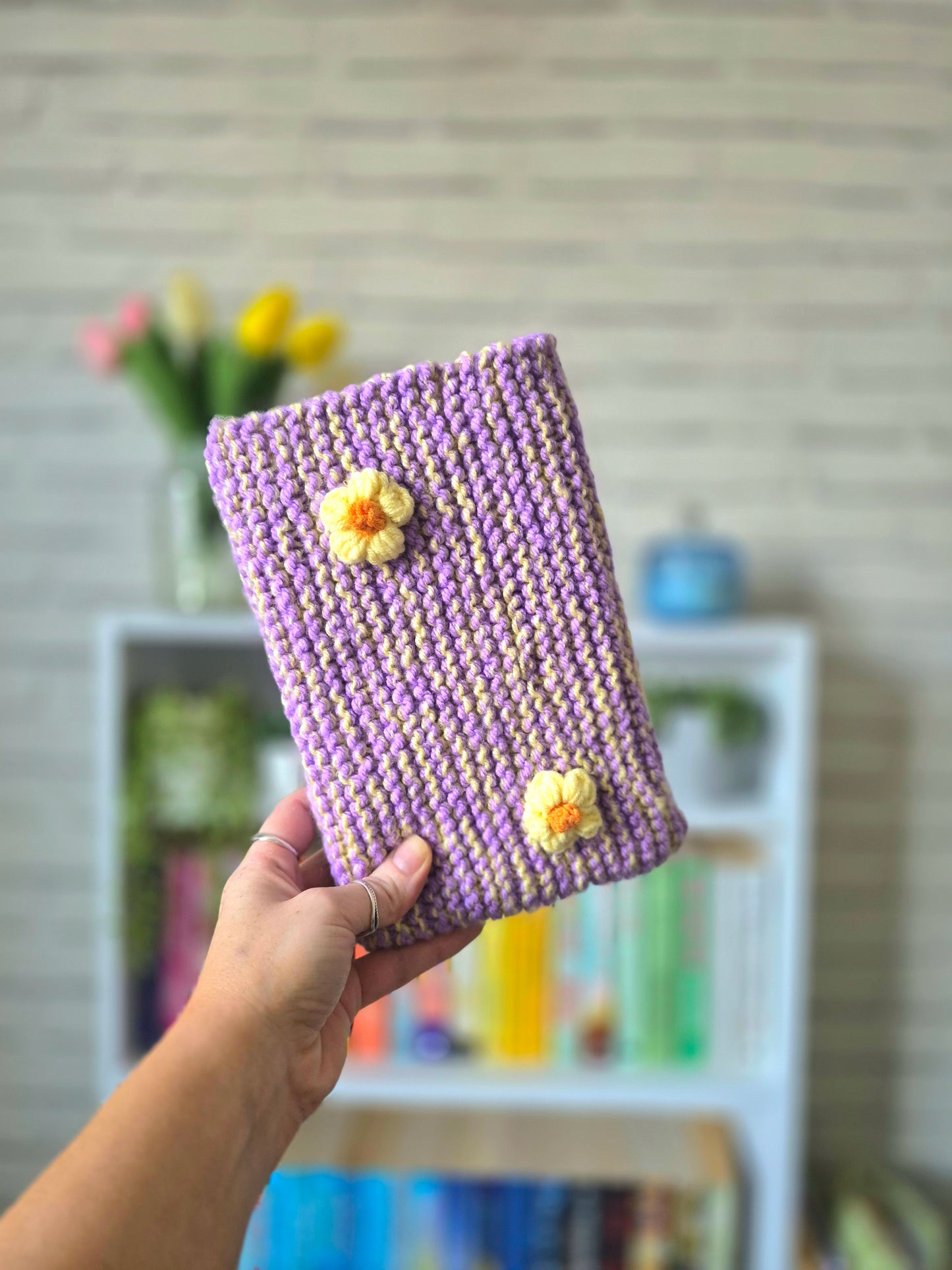 Purple and yellow Knitted book sleeve with yellow flowers