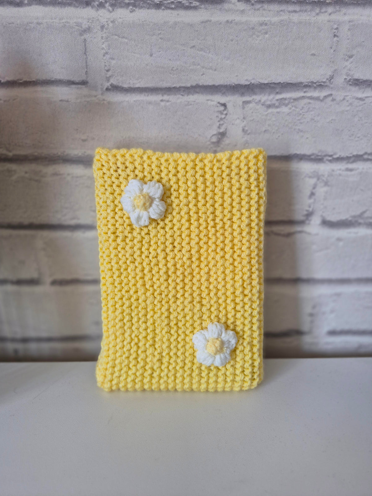 Butter Yellow Knitted book sleeve with white flowers