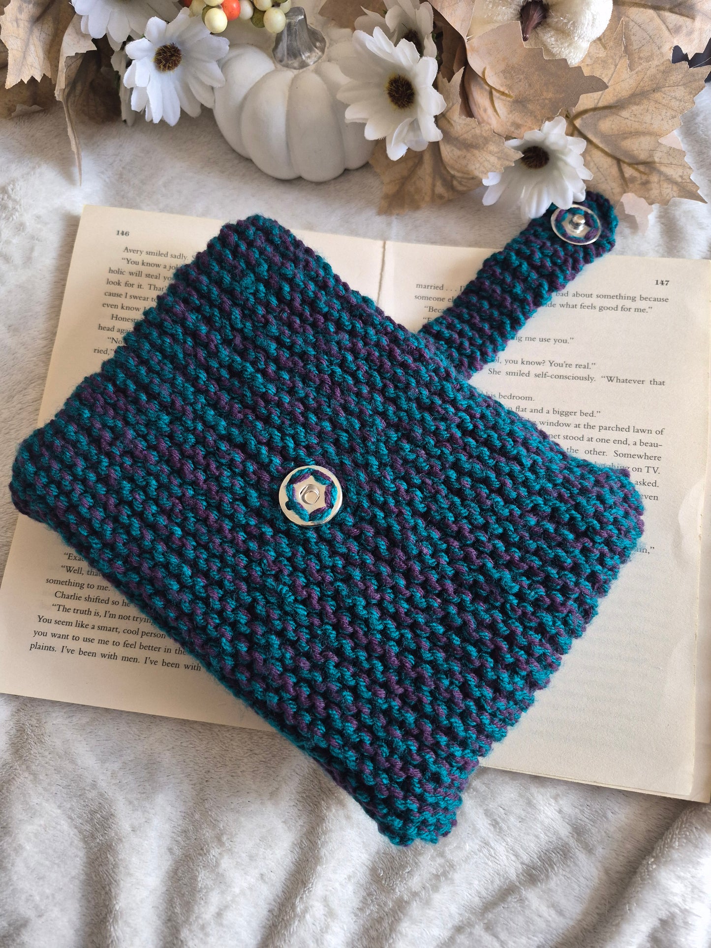 Dark blue and purple knitted book sleeve