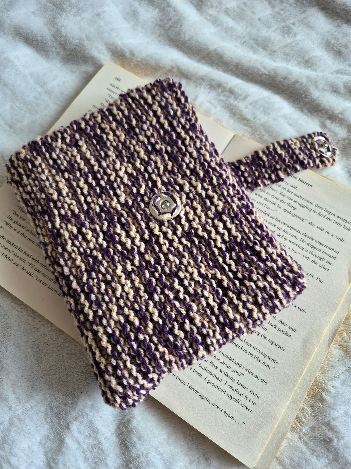 Purple and cream knitted book sleeve