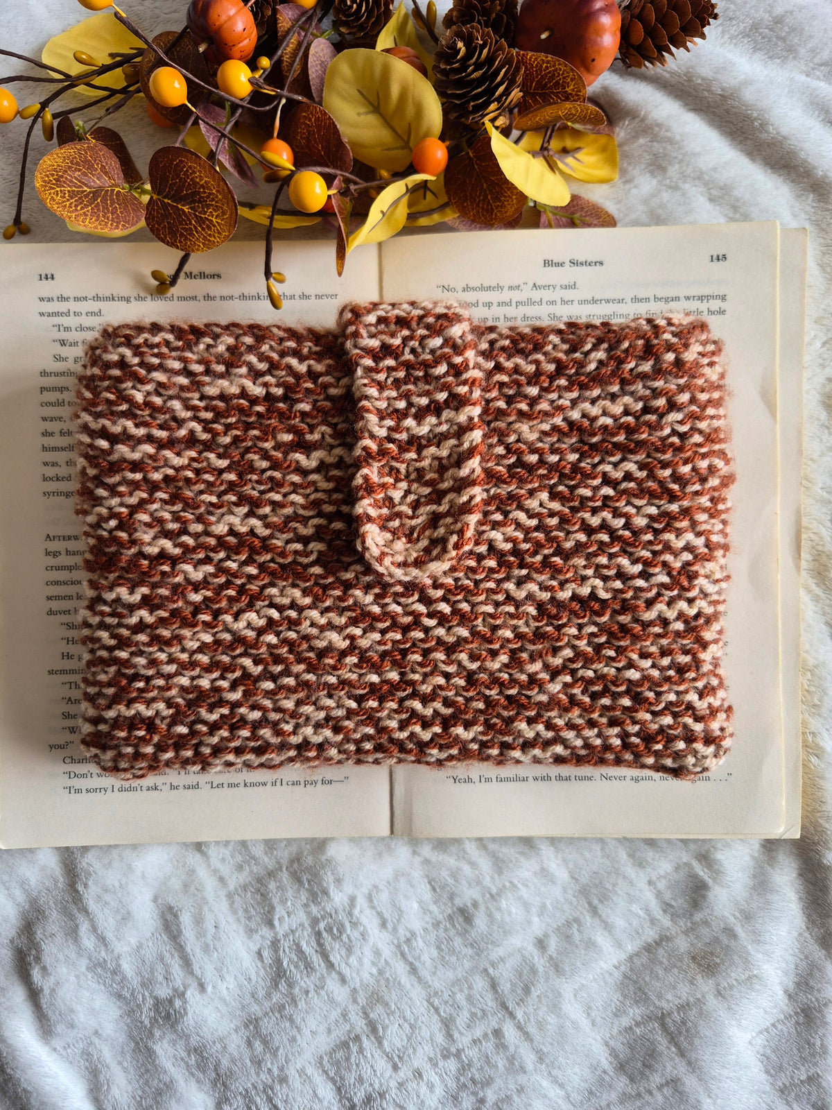 Brown and cream autumnal knitted book sleeve