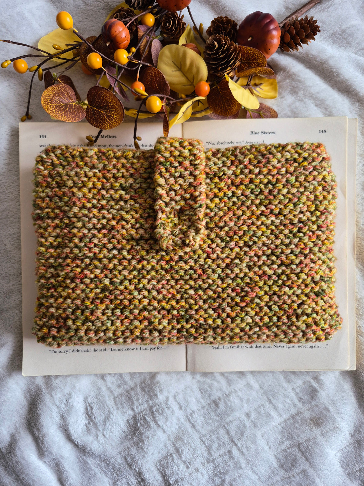 Mixed autumnal colours knitted book sleeve