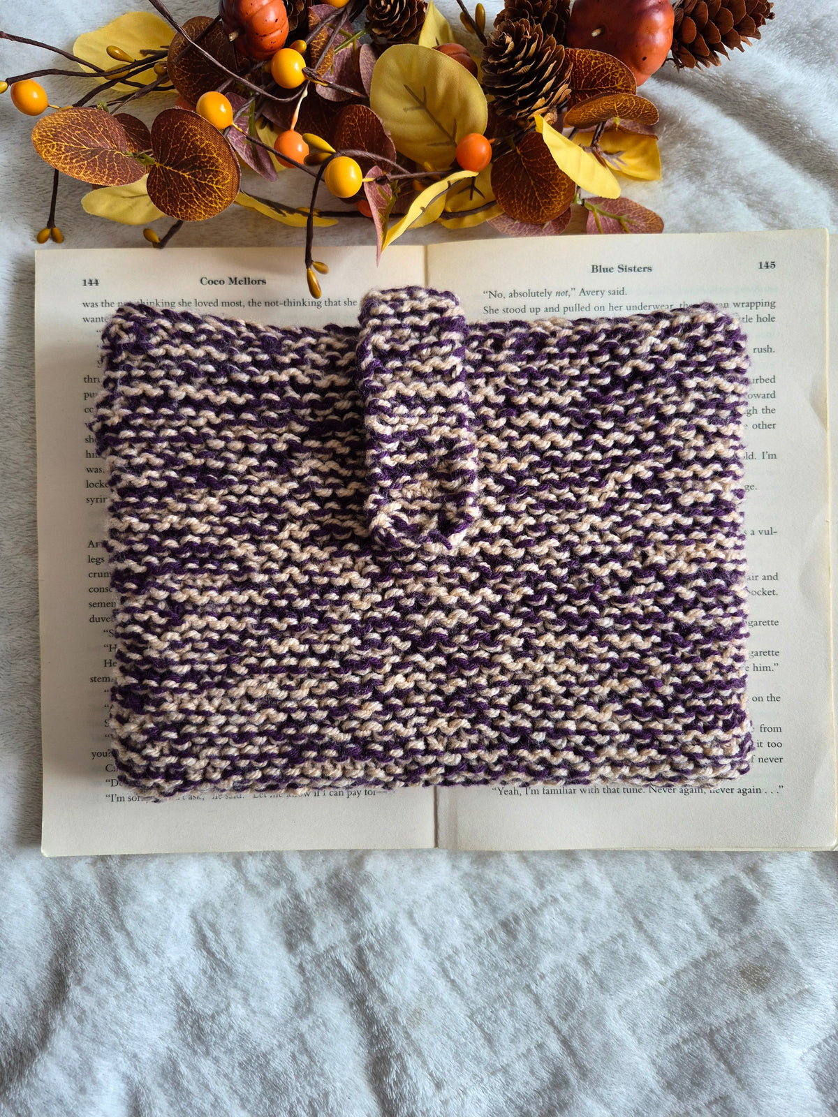Purple and cream knitted book sleeve