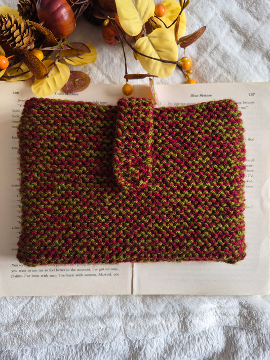 Dark red and green knitted book sleeve