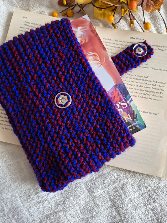 Blue and red knitted book sleeve with snap button closure
